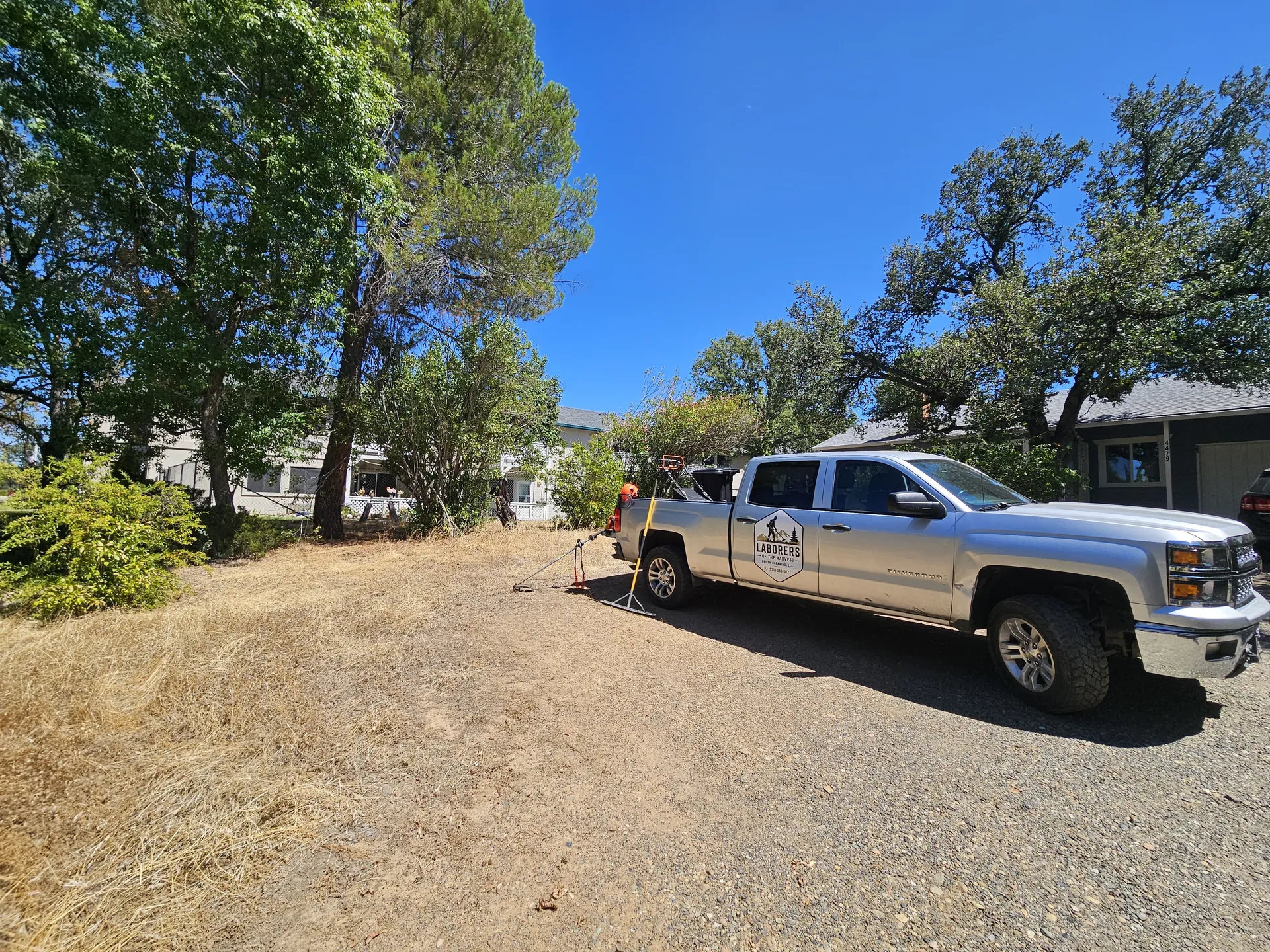 Laborers of the Harvest work truck on a freshly cleared Shasta County lot